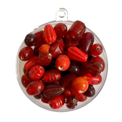Assorted glass beads in a red colour mix by Craftworkz. Made in India.