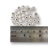 Craftworkz 6mm wooden beads in White. Sold in packs of 100 pieces, and available in a multi coloured or single colour packs. Craftworkz 6mm wooden beads have a hole size of approximately 2mm. Some slight variation in size is normal.
