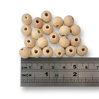 Craftworkz 10mm wooden beads in Raw. Sold in packs of 100 pieces, also available in single colour packs. These 10mm wooden beads have a hole size of approximately 3mm. Some slight variation in size is normal.