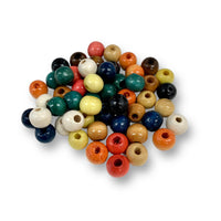 Craftworkz 10mm  multi vintage coloured pack of wooden beads. Sold in packs of 100 pieces, also available in single colour packs. These 10mm wooden beads have a hole size of approximately 3mm. Some slight variation in size is normal.