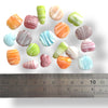 An assorted mix of matt glass beads with a swirl pattern, ranging in size from approximately 12mm - 20mm.
Each pack contains a random mix of colours, shapes and sizes. Made in India.