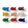 Glass fish shaped beads in assorted colours on a white background
