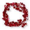 A wired star garland made up of red colored star-shaped elements coiled into a circle on a white background.