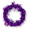 A wired tinsel star garland made up of purple colored star-shaped elements coiled into a circle on a white background.