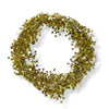 A wired star garland made up of gold colored star-shaped elements coiled into a circle on a white background.