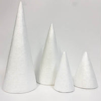 4 Polystyrene cones of different sizes on a white background