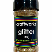 A shaker jar containing ultra fine holographic glitter, with label indicating the brand, weight, and characteristics of the glitter.