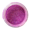 A round colour sample swatch of holographic pink ultra fine glitter