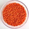 Craftworkz size 10/0 approx. 2mm glass seed beads in opaque orange. Available in over 30 colours.