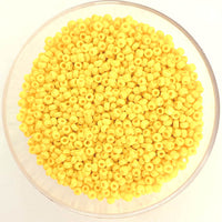 Craftworkz size 10/0 approx. 2mm glass seed beads in opaque yellow. Available in over 30 colours.