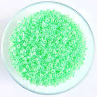 Craftworkz size 10/0 approx. 2mm glass seed beads in pearl green. Available in over 30 colours.