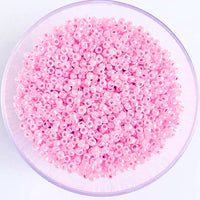Craftworkz size 10/0 approx. 2mm glass seed beads in pearl pink. Available in over 30 colours.