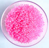 Craftworkz size 10/0 approx. 2mm glass seed beads in transparent hot pink. Available in over 30 colours.