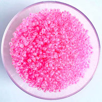 Craftworkz size 10/0 approx. 2mm glass seed beads in transparent hot pink. Available in over 30 colours.