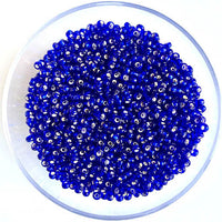 Craftworkz size 10/0 approx. 2mm glass seed beads in transparent royal blue. Available in over 30 colours.