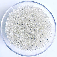Craftworkz size 10/0 approx. 2mm glass seed beads in transparent silver. Available in over 30 colours.