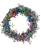 A wired star garland made up of multicolored star-shaped elements on a white background.