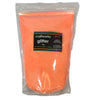 A clear plastic bag containing orange ultra fine opalescent glitter with a label displaying the brand 'craftworkz' and the weight '1kg'.